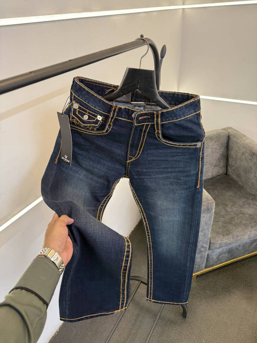 True religion hyperflex blue imported denim with brand button and pattern on back