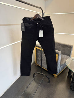 Givench y Jet black imported denim with brand buttons and pockets