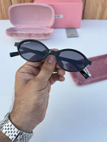 Miu_miu_5519_black_gold