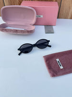 Miu_miu_5519_black_gold