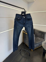 True religion hyperflex blue imported denim with brand button and pattern on back