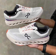 ON Cloudsurfer Next running trainers in white and red 539