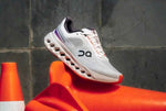 ON Cloudsurfer Next running trainers in white and red 539