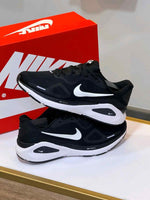 Nike Running Structure 26 trainers in black and white