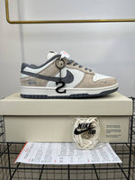 dunk low x stussy rice white carbon 384