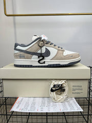 dunk low x stussy rice white carbon 384