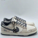 dunk low x stussy rice white carbon 384