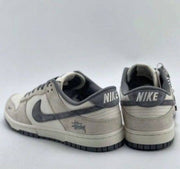 dunk low x stussy rice white carbon 384