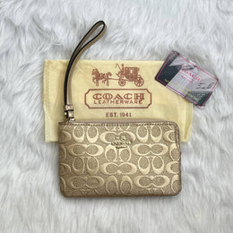 Coach_Golden_Emboss_Wristlet_With_DustCover